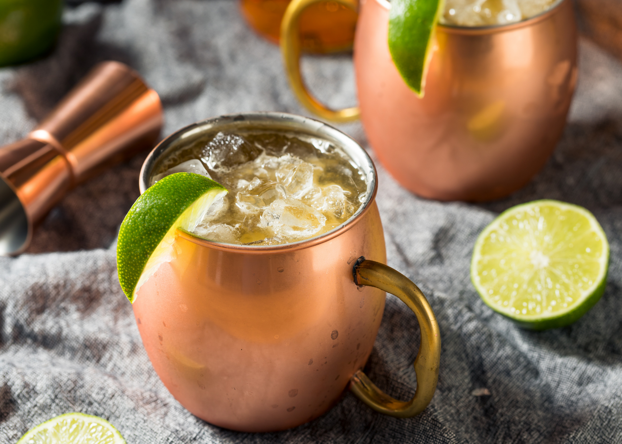 Kentucky mule with ice in copper mug and lime wedge